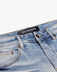 "MR. EXTENDO" LIGHT WASH STACKED FLARE JEAN