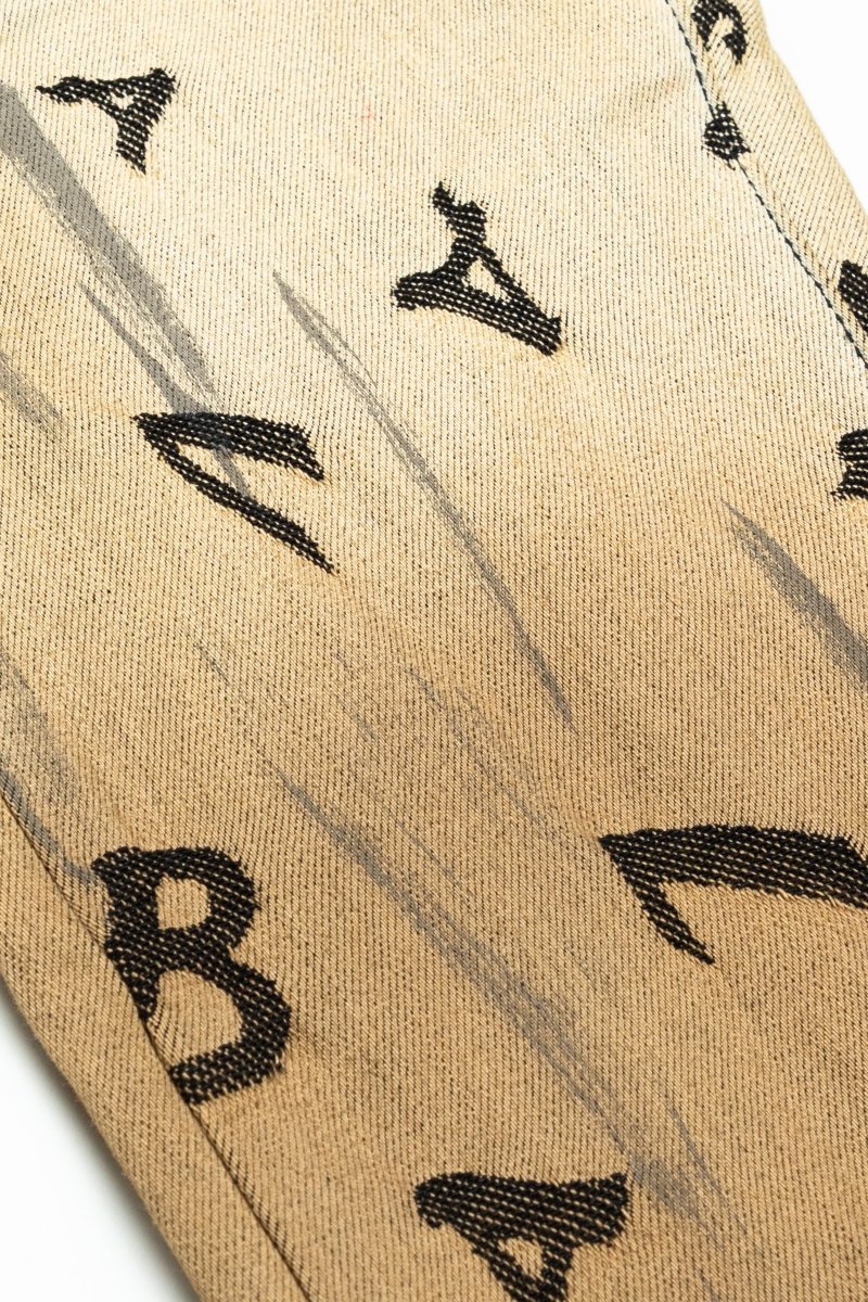 “V - SCRABBLE” STACKED FLARE JEAN CHAMOIS - Valabasas