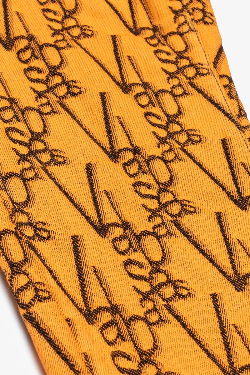 "V - SCRAWL" STACKED FLARE JEAN BLACK ORANGE - Valabasas